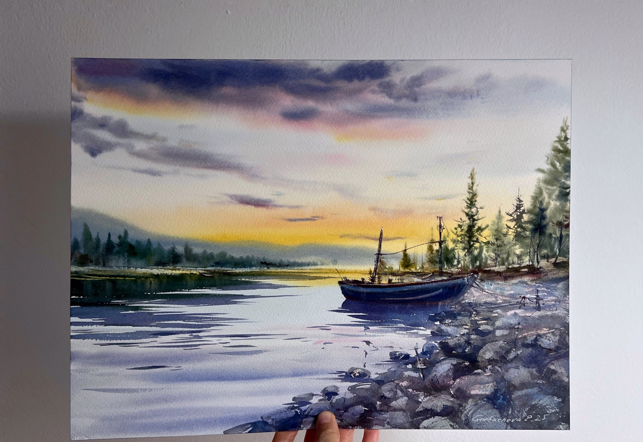 A lonely boat at sunset